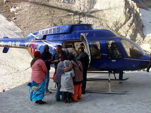 Pilgrims boarding a helicopter in the Trikuta hills